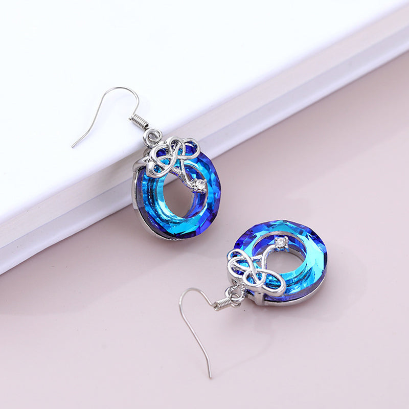 Ensemble de collier et de boucles d'oreilles en cristal d'amour infini