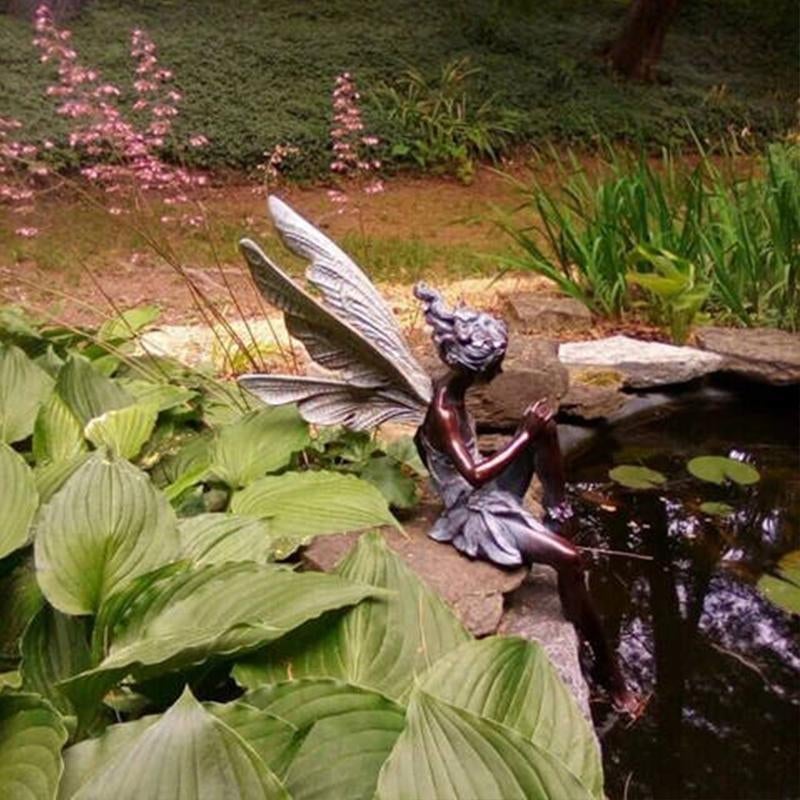 Statue de jardin féerique assise